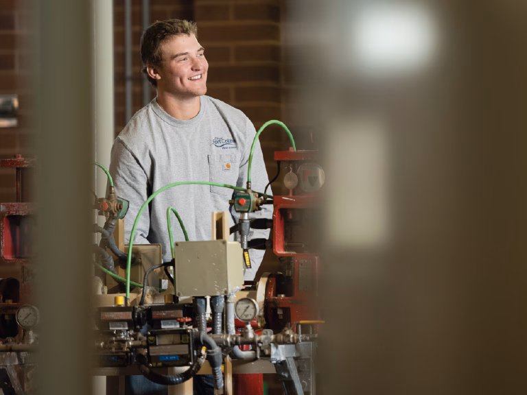 A water operator works with equipment.