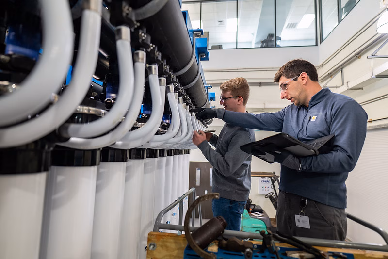 Operators work in a water treatment plant.