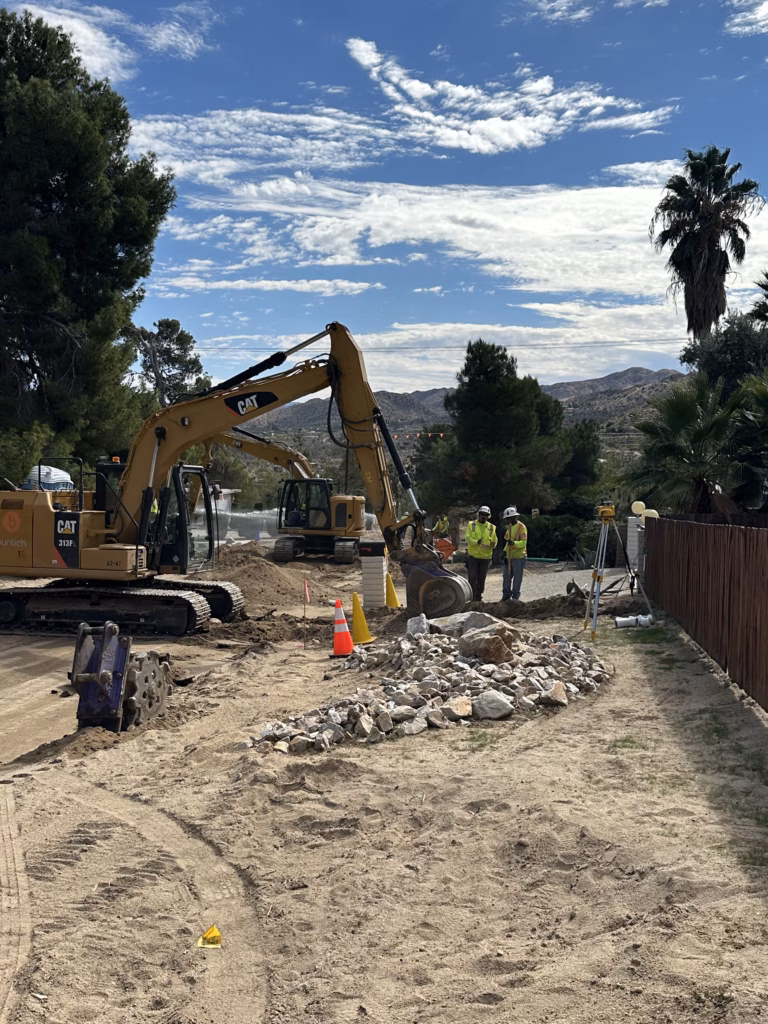 Crews working to install sewer main line.