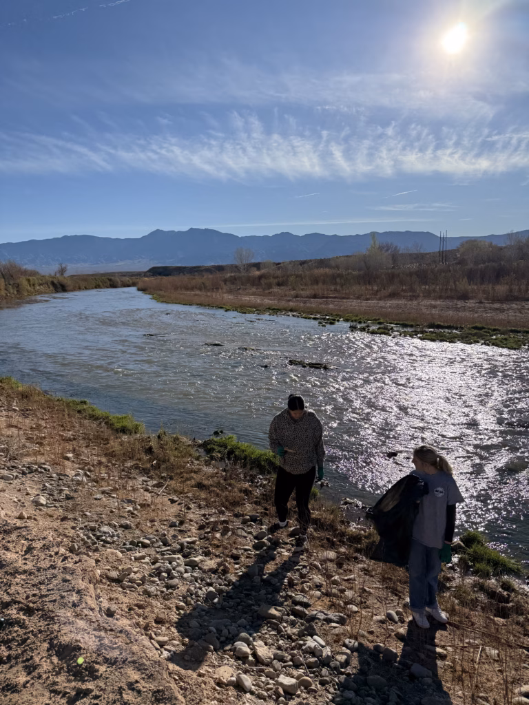 Volunteers participate in a river clean-up activity.