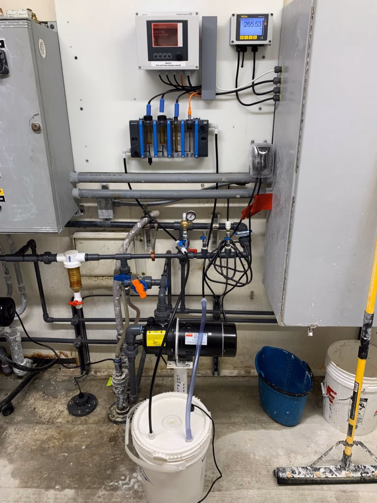 A close-up of a bucket filtration device in a water plant.