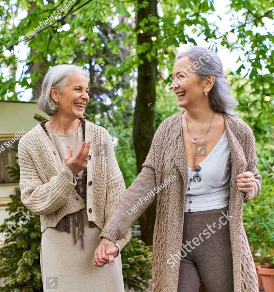 stock-photo-a-lesbian-couple-enjoys-a-carefree-stroll-through-a-verdant-forest-during-a-camping-trip-2471358519