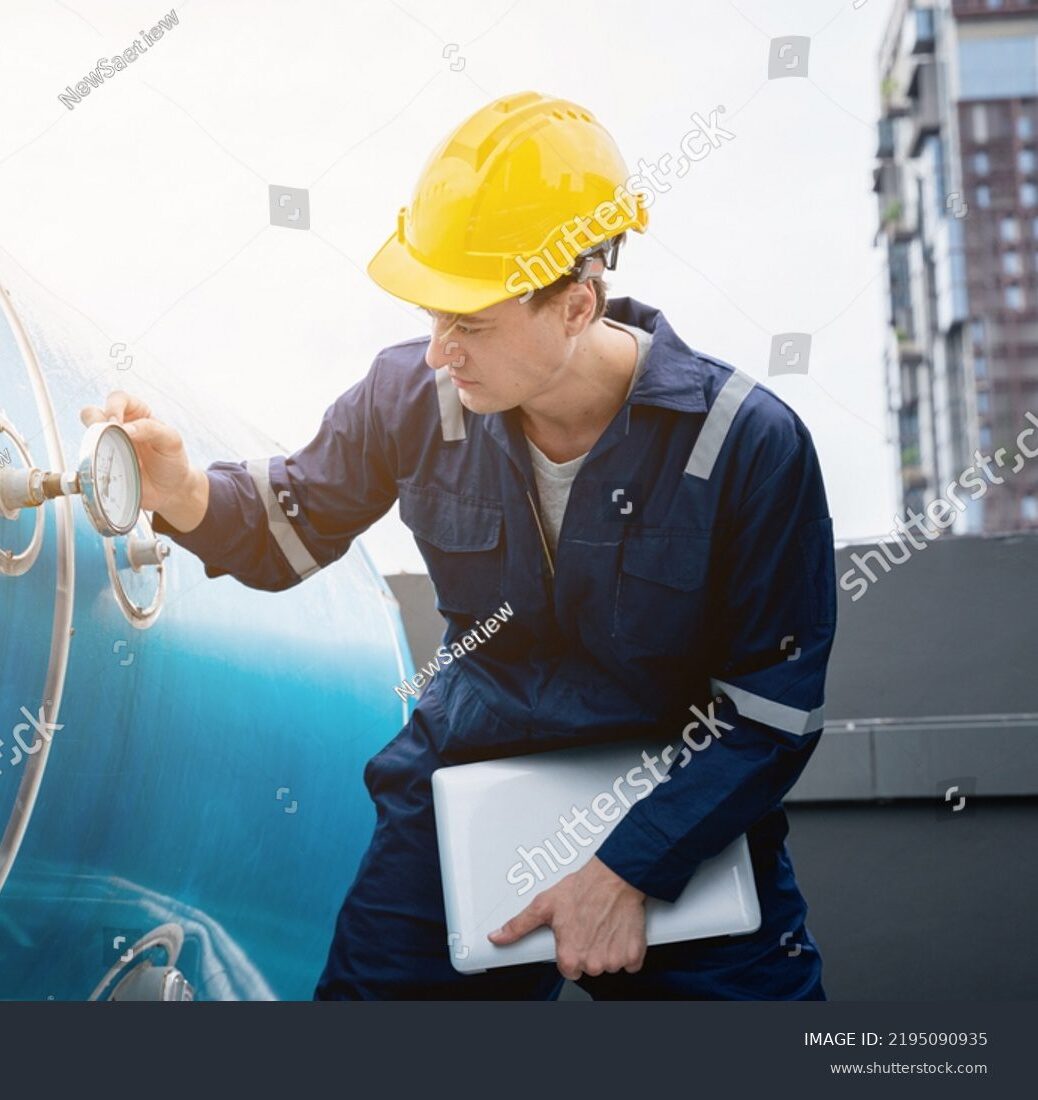 stock-photo-a-team-of-engineers-is-checking-the-air-conditioning-cooling-system-of-a-major-building-or-2195090935
