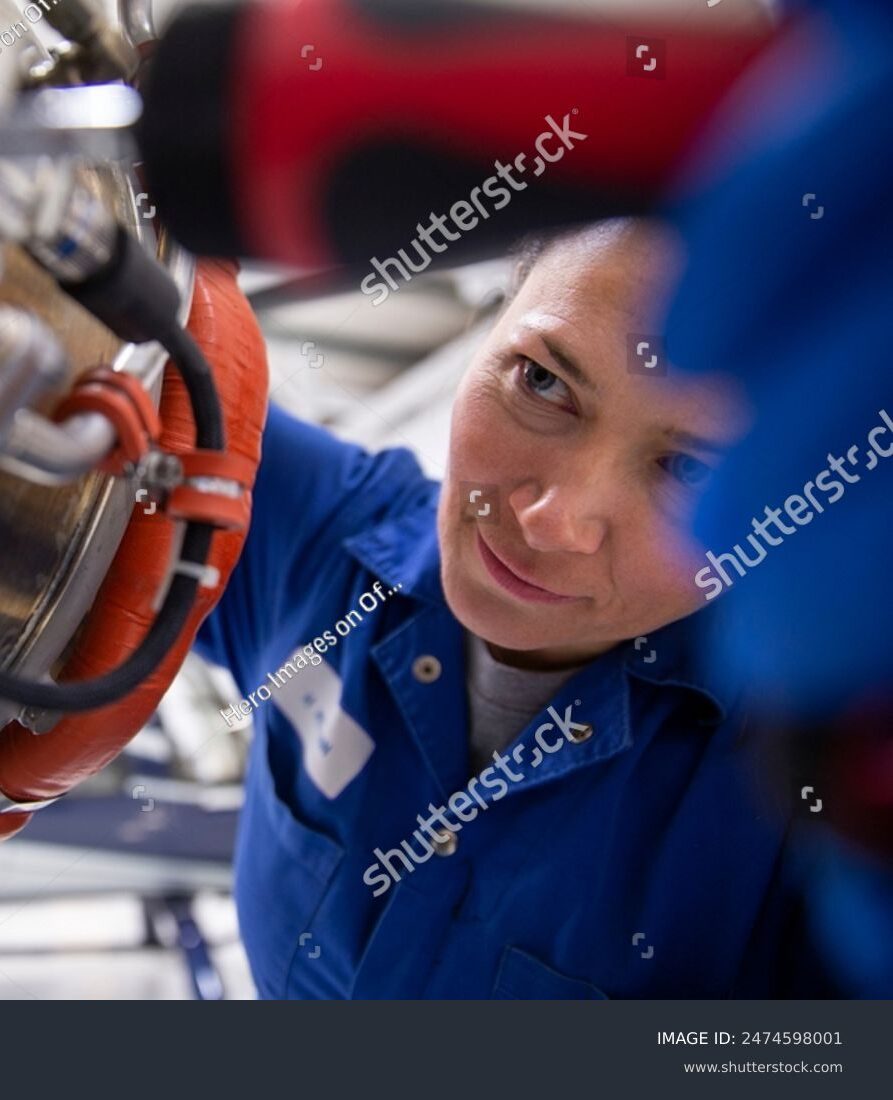 stock-photo-close-up-portrait-female-engineer-fixing-airplane-part-in-hangar-2474598001