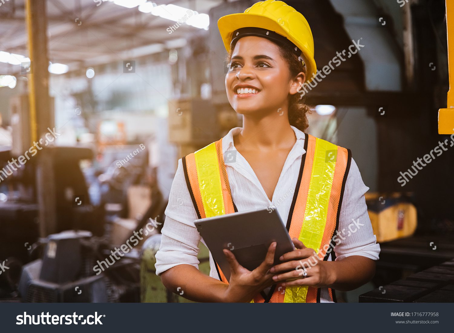 stock-photo-industry-maintenance-engineer-woman-dark-skin-wearing-uniform-and-safety-helmet-under-inspection-1716777958