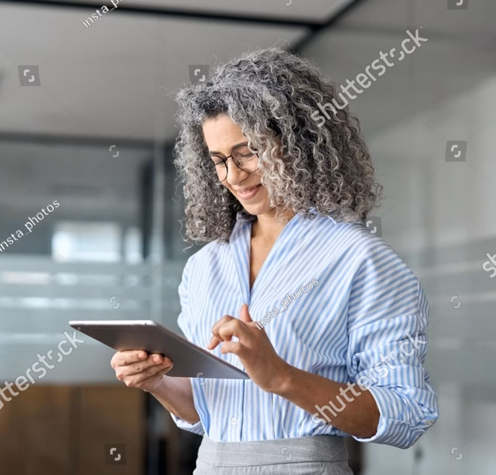 stock-photo-mature-busy-happy-businesswoman-bank-manager-older-female-corporate-executive-holding-digital-2418447459