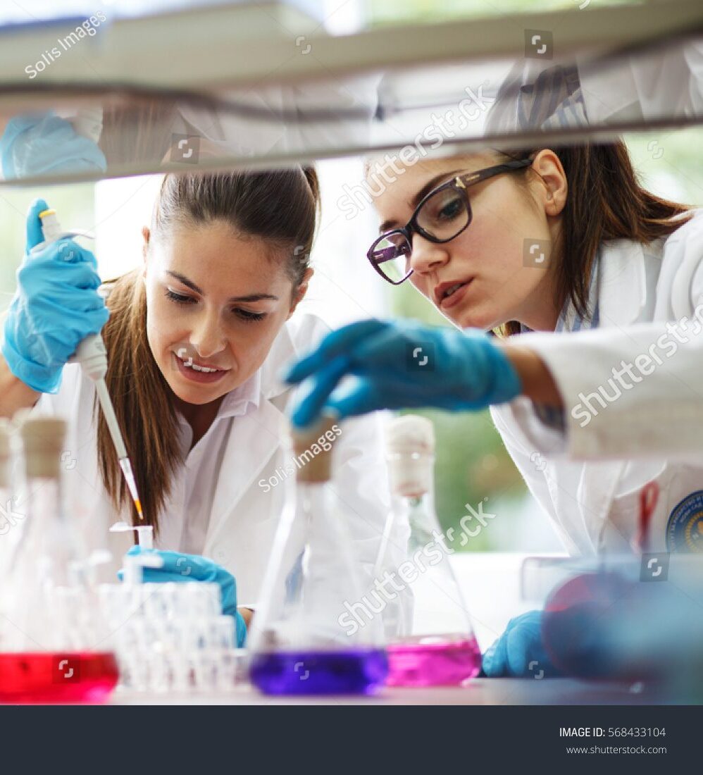 stock-photo-two-young-female-scientist-doing-experiments-in-lab-568433104